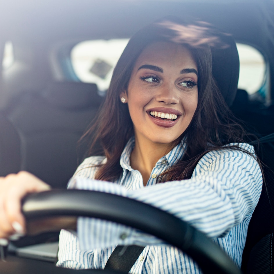 woman behind steering wheel