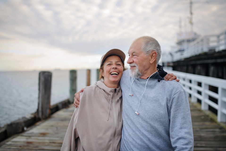 elderly couple on a pier
