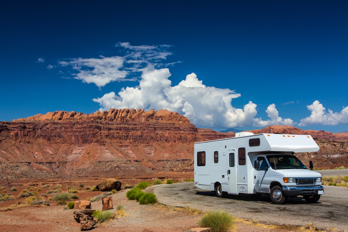 Photo of a RV in front of a mountain