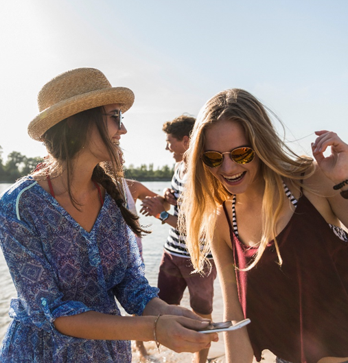 Friends laughing on a beach