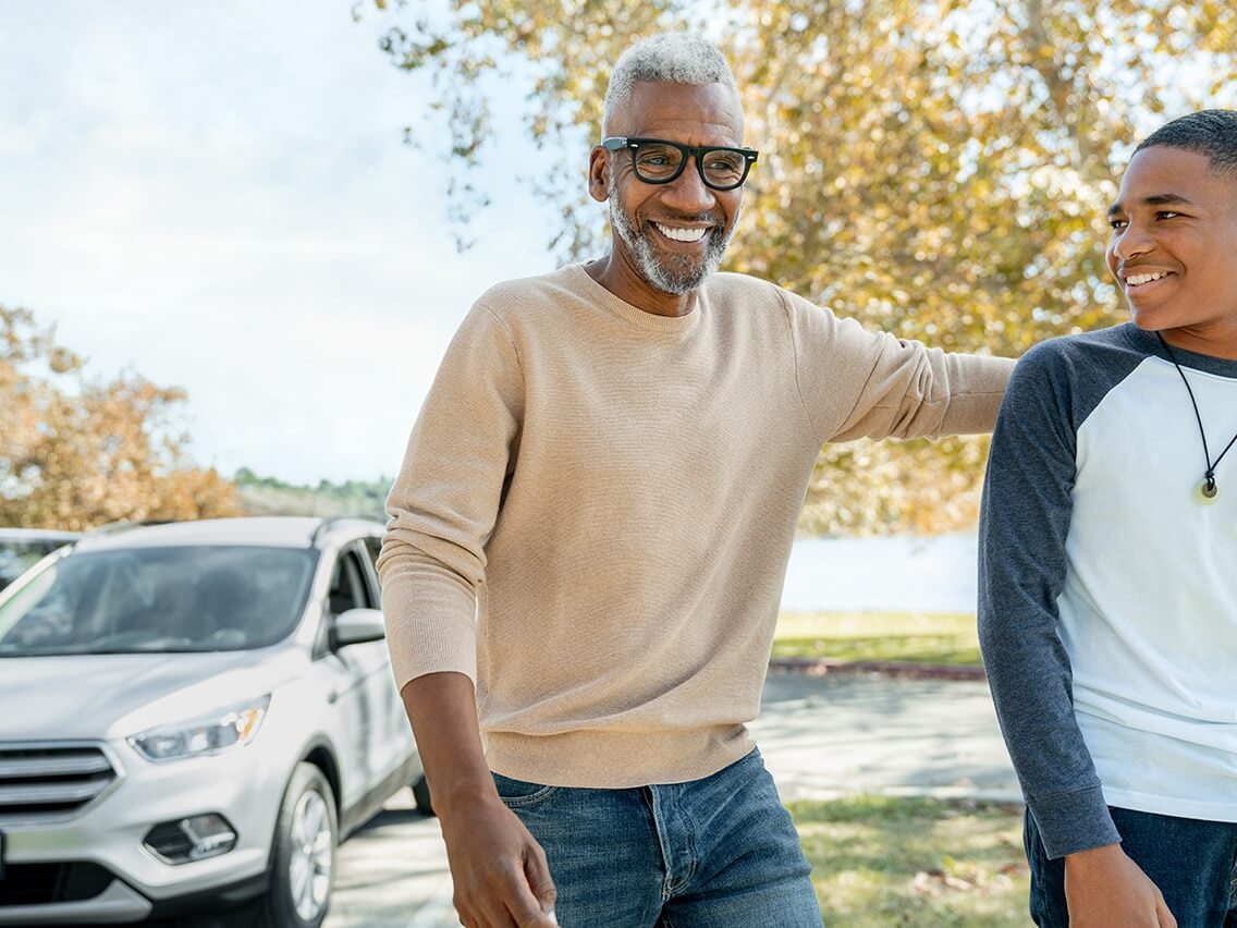 Father who is proud of his son for driving safely