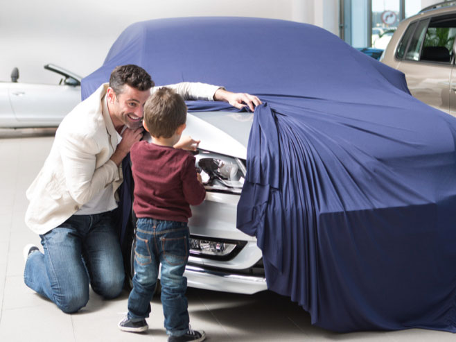 Dad shows toddler new car