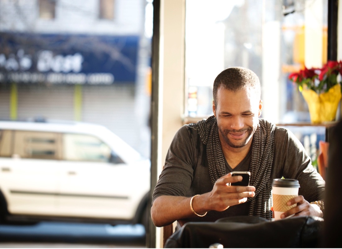 man on phone in coffee shop