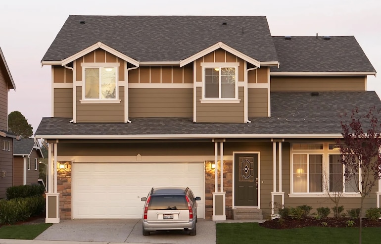 Front view of house with car in driveway
