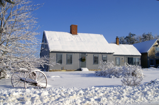 House and yard covered in snow