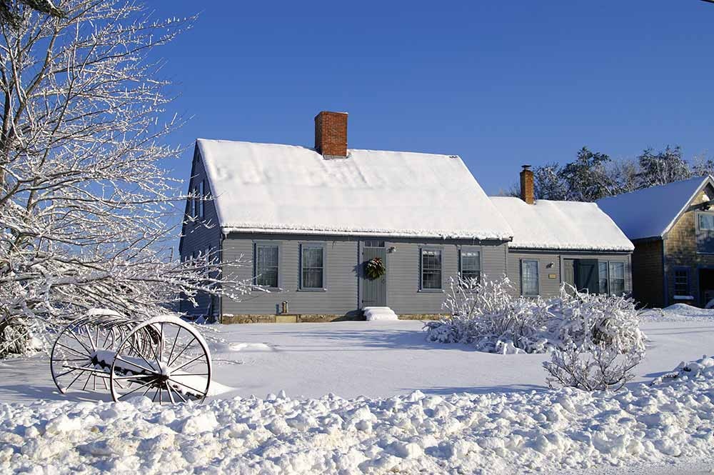 House and yard covered in snow