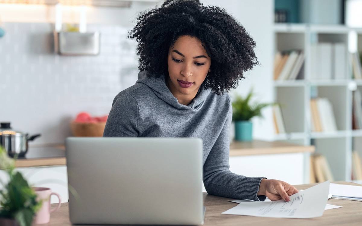 Woman looking at her laptop