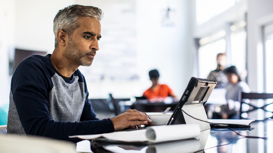 Man looking at his computer