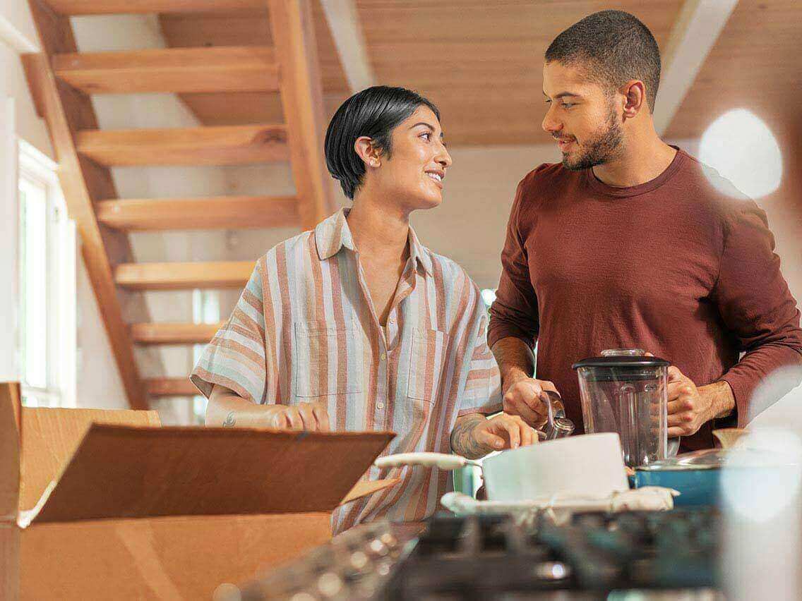 Couple unpacking in their new apartment