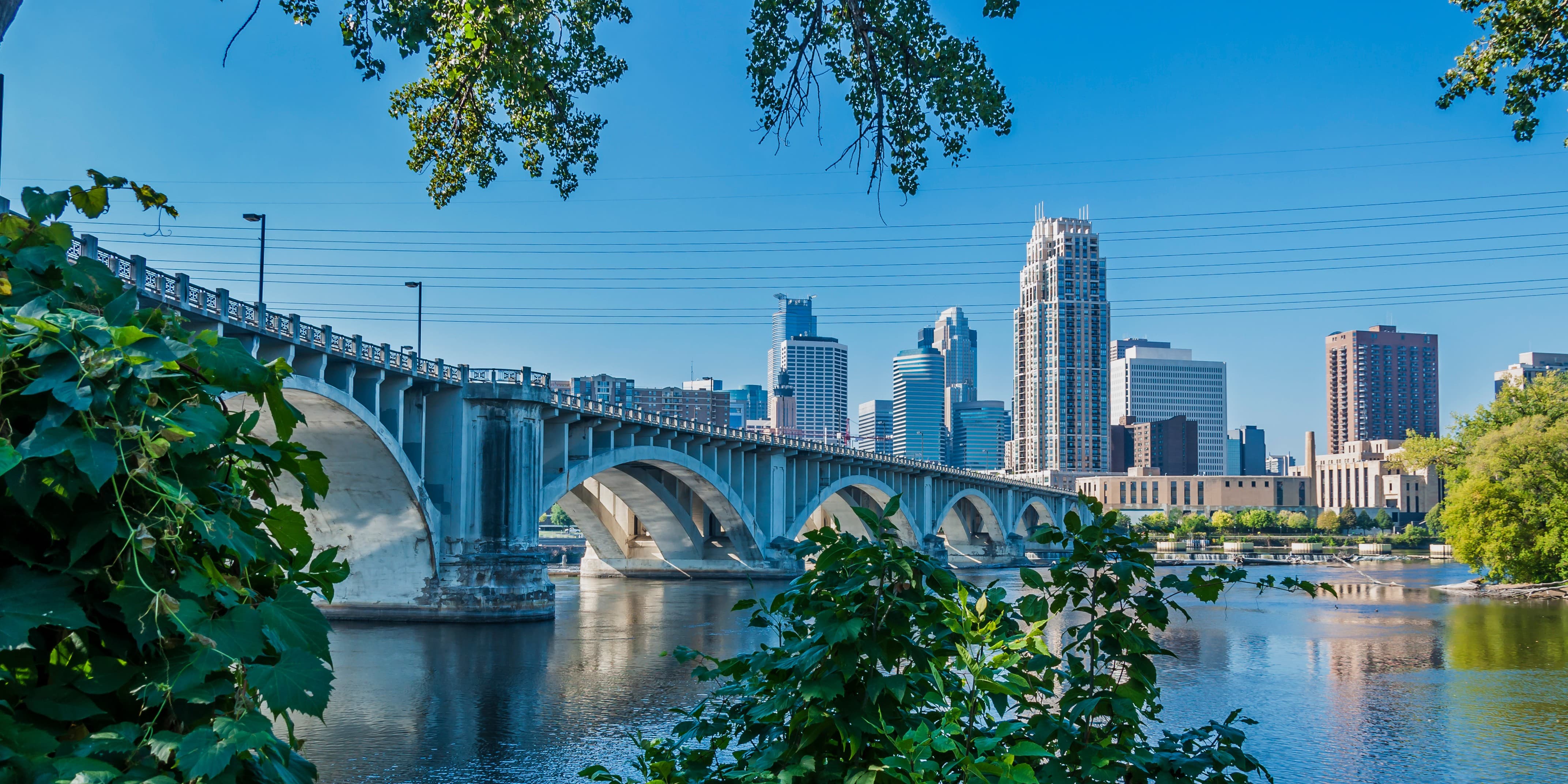 View of a bridge in Minnesota with a city in the background