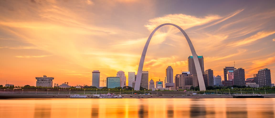 View of St. Louis with the arch and sunset in the background