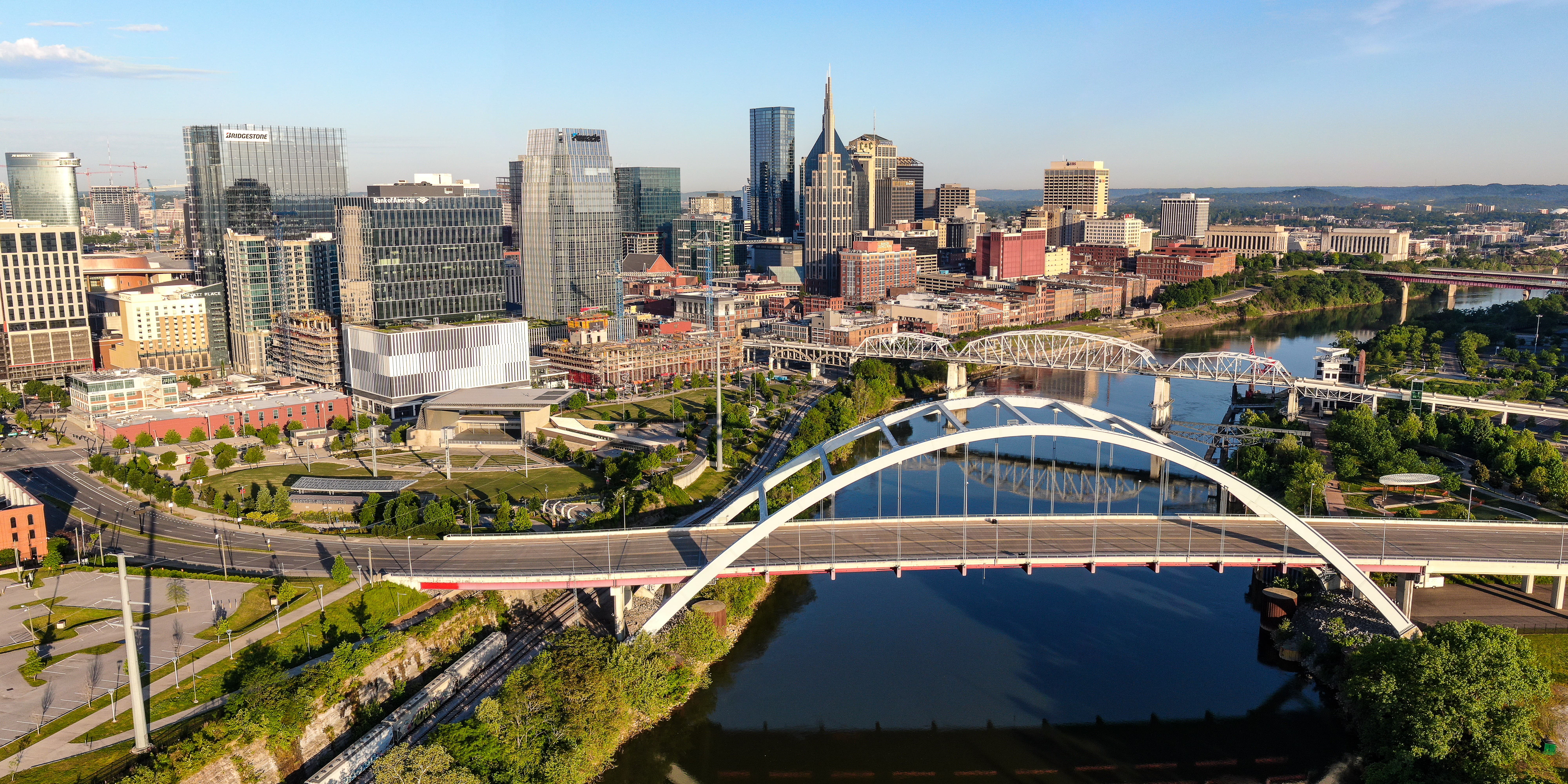 View of a two bridges in Tennessee with a city in the background