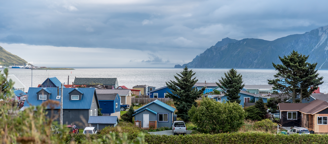 View of houses with water and mountains