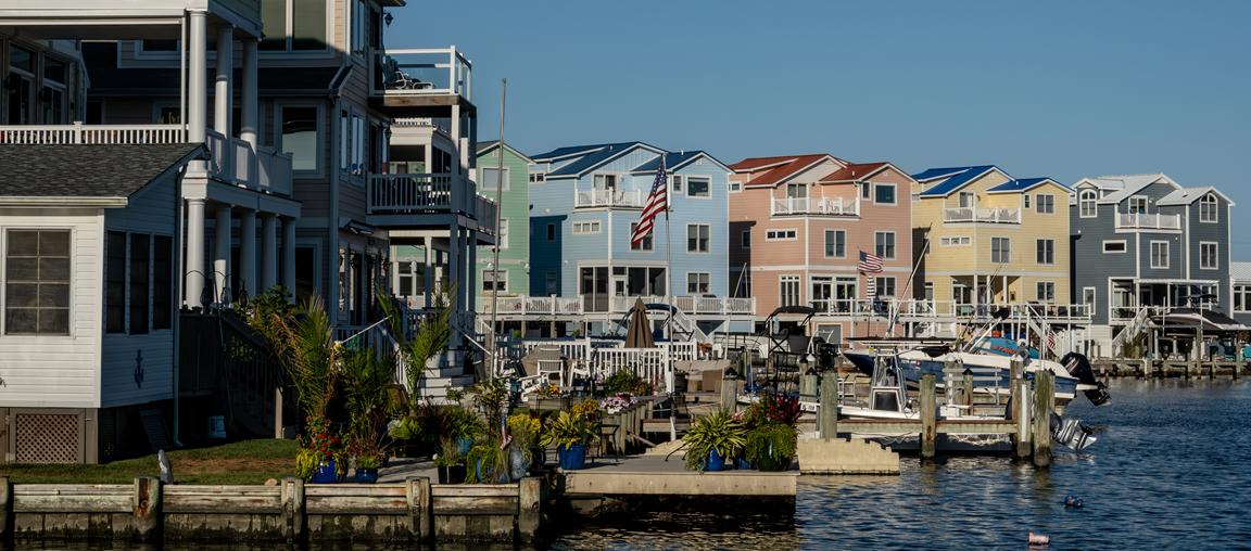 View of houses on the water with boats