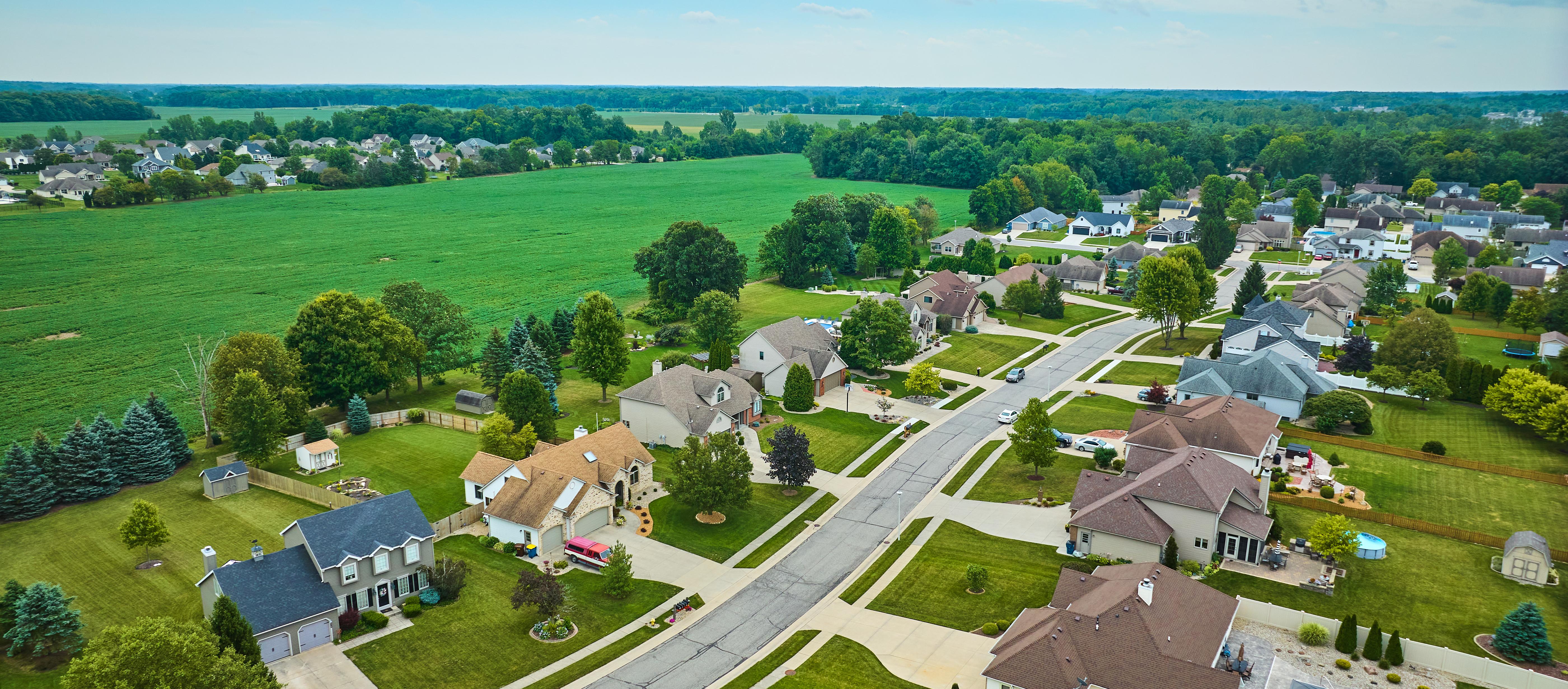 Indiana suburb with a large open field behind the homes