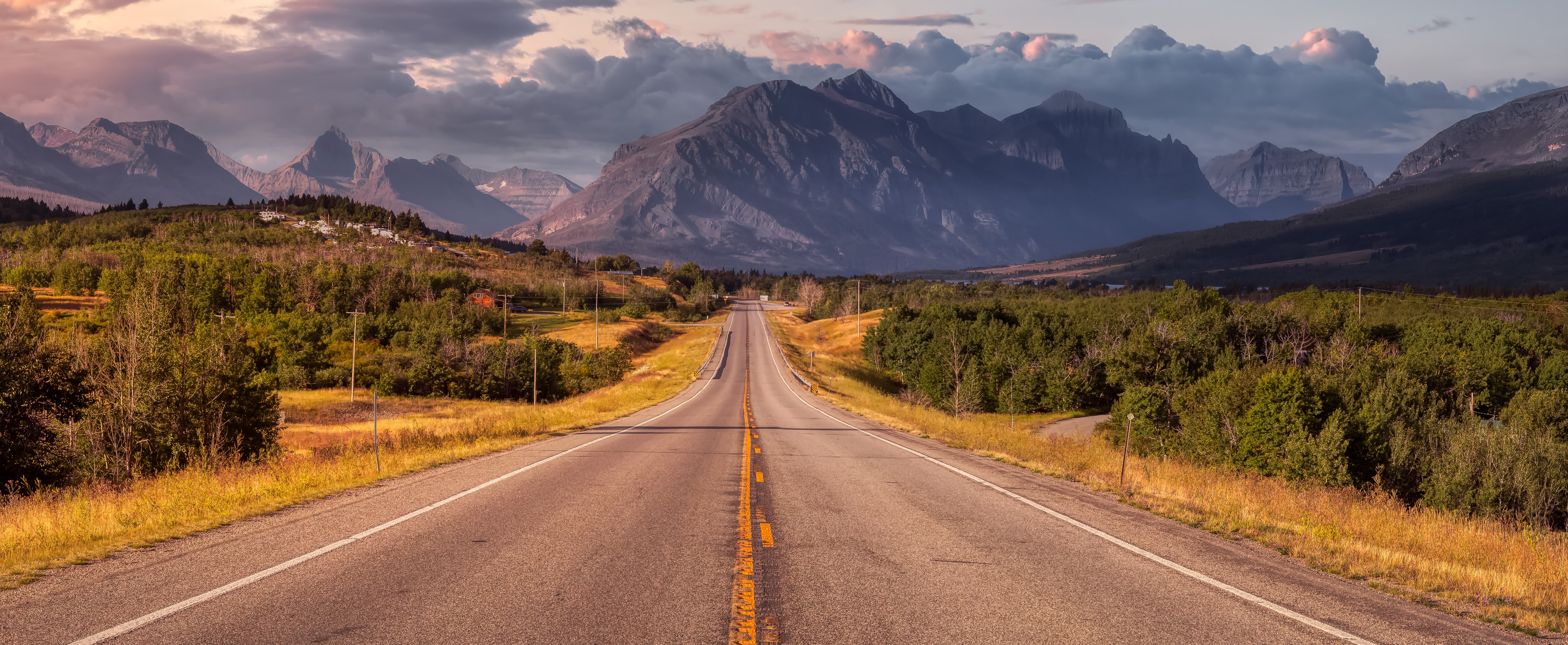 sunset highway with rocky mountains in Montana