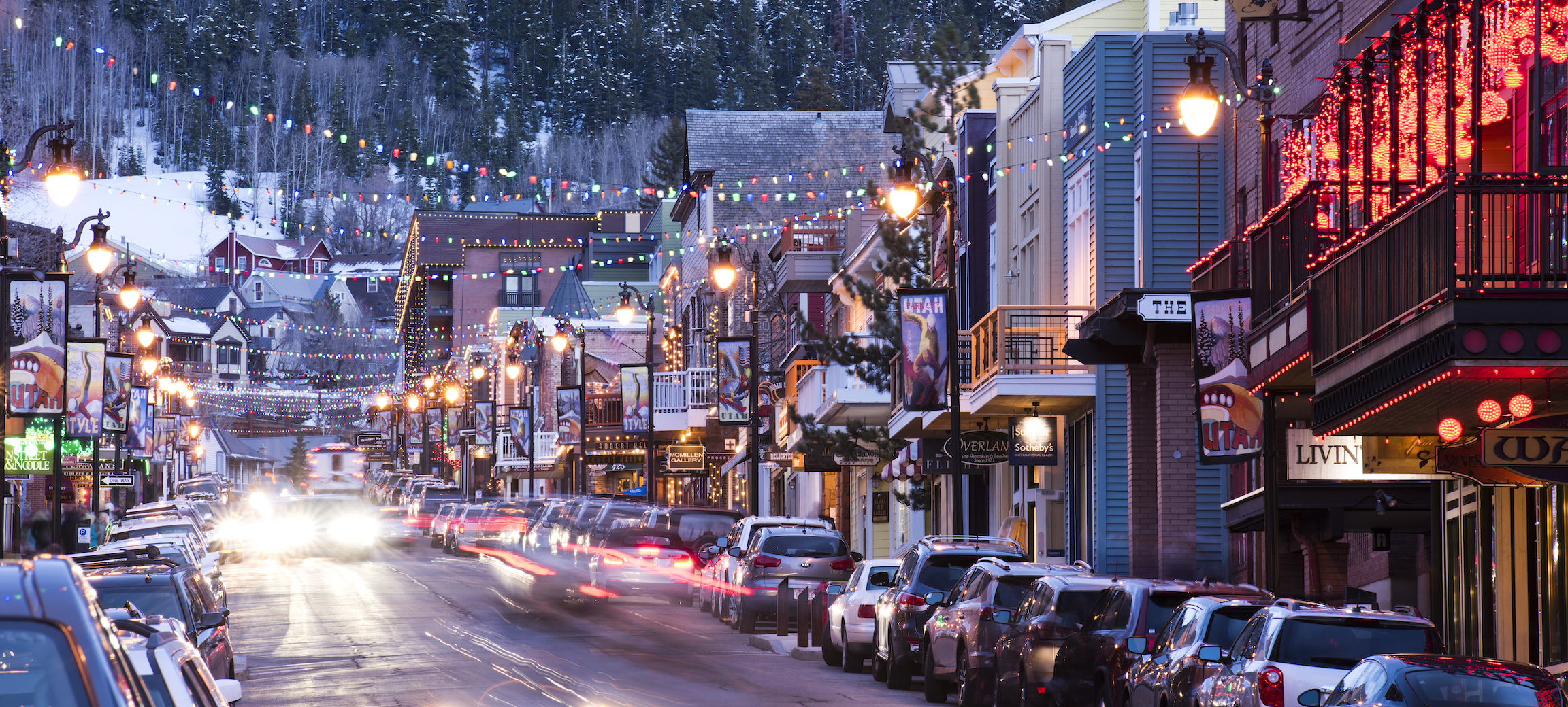 View of street lined with shops and christmas lights