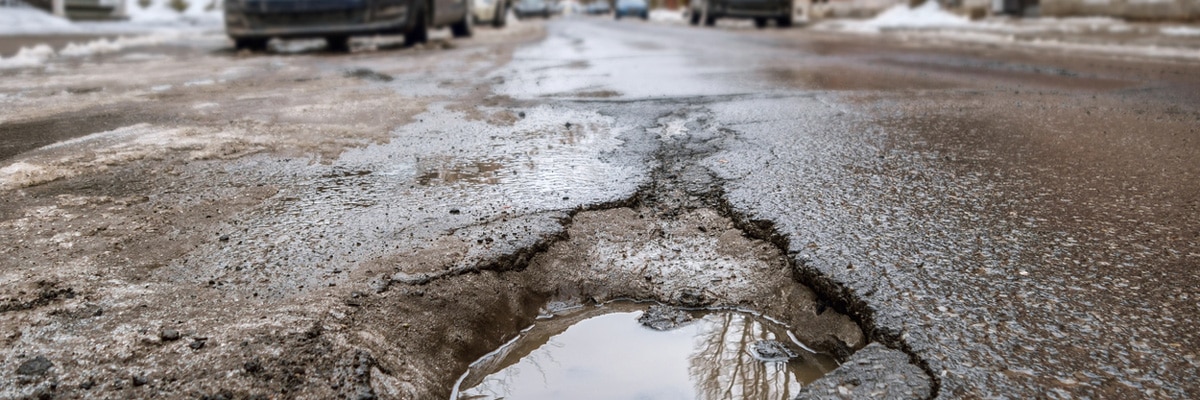 pothole filled with water pothole filled with water