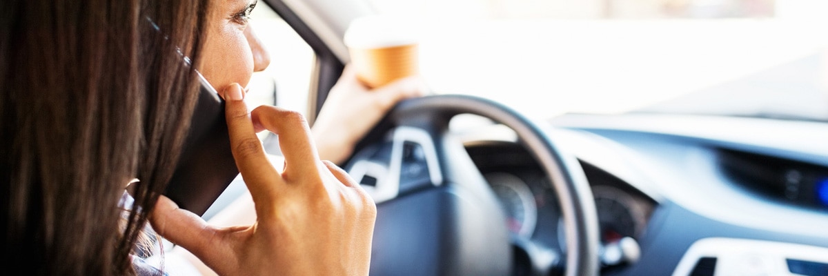 woman talking on phone while driving woman talking on phone while driving