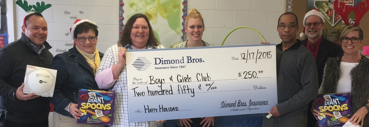 Dimond Bros. Insurance staff present check to Club Dimond Bros. Insurance staff present check to Club