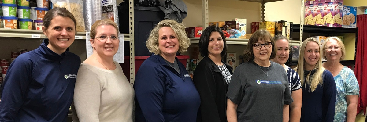 volunteers providing food for local families