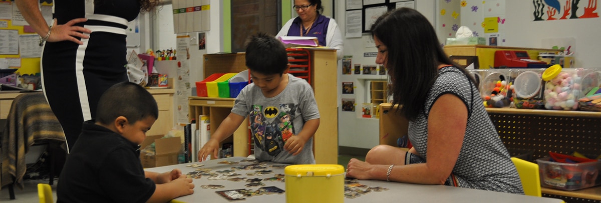 agent helping children solve puzzles