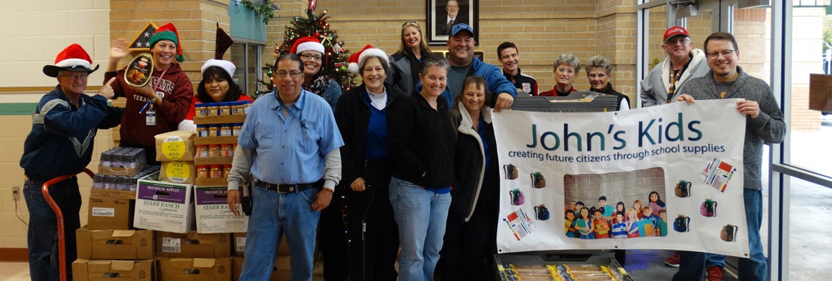 agents help school officials unload donated food