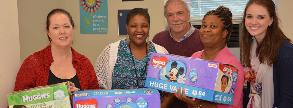 agency staff donating diapers to nonprofit agency staff donating diapers to nonprofit