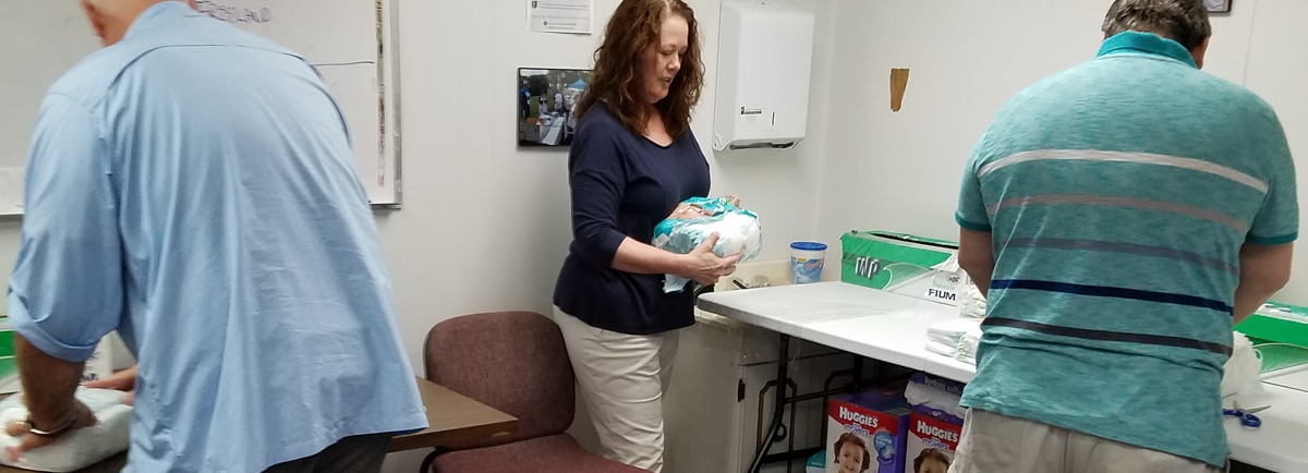 agents wrapping diapers for distribution