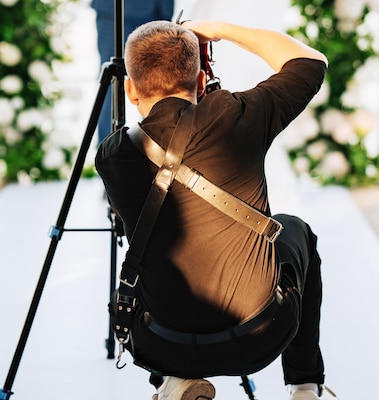A photographer is taking a photo at a wedding