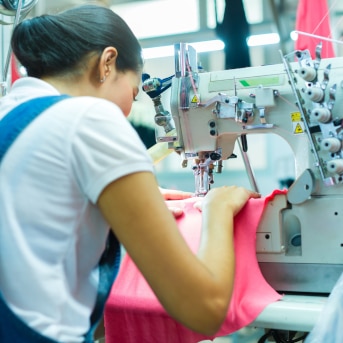 A woman using a sewing machine